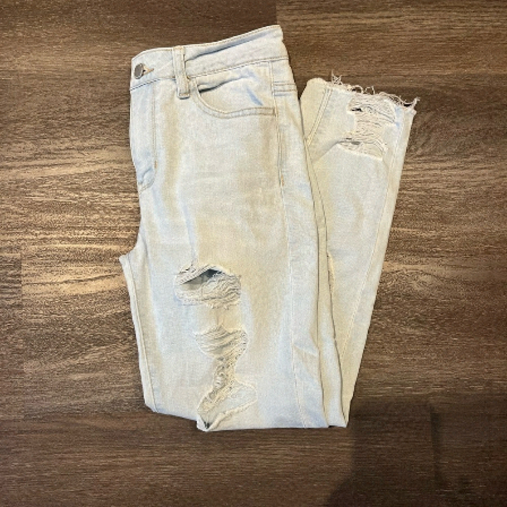 Revamped denim distressed jeans